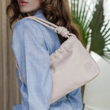 Load image into Gallery viewer, THE MAYA handcrafted leather mini shoulder bag in Ivory, on model — LUXUL COLLECTIVE