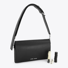 Load image into Gallery viewer, Black leather backgammon handbag by L'Eterna Vacanza, closed with dice and pieces beside it — LUXUL COLLECTIVE